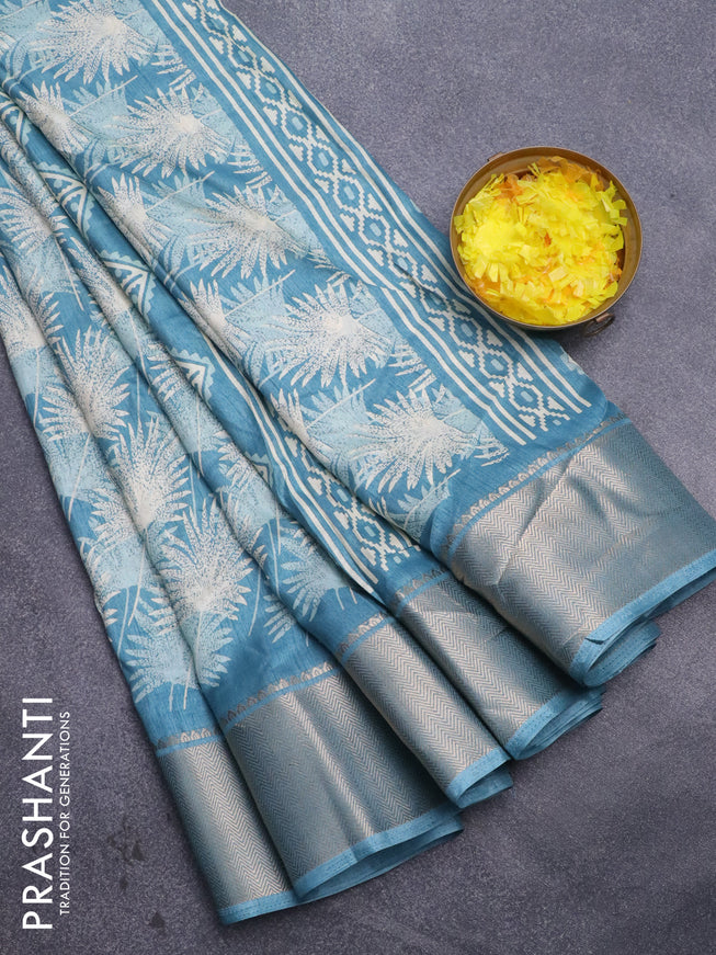 Semi dola saree blue shade with allover prints and zari woven border