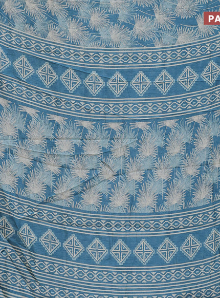 Semi dola saree blue shade with allover prints and zari woven border