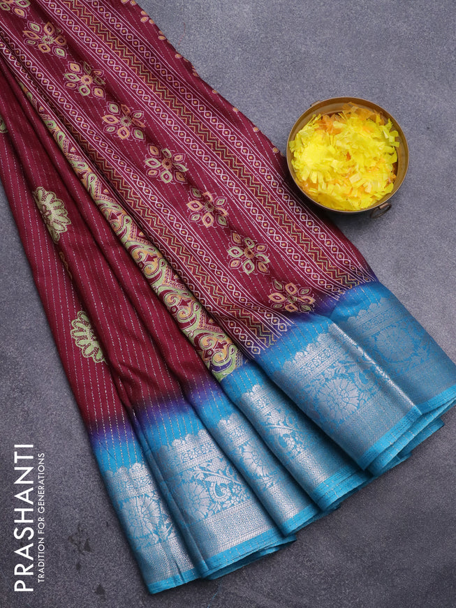 Semi dola saree deep maroon and cs blue with allover zari weaves & floral digital butta prints and zari woven border