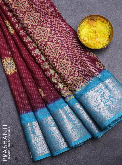 Semi dola saree deep maroon and cs blue with allover zari weaves & floral digital butta prints and zari woven border