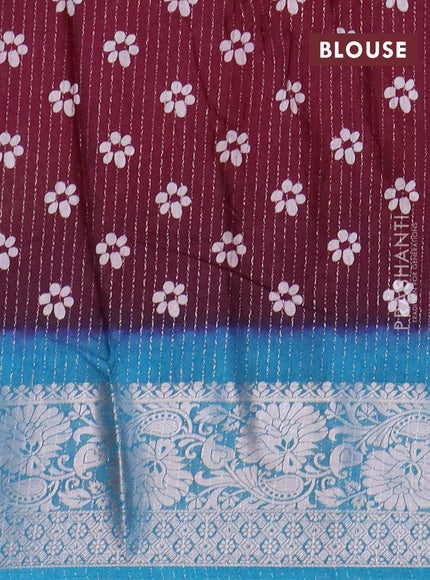 Semi dola saree deep maroon and cs blue with allover zari weaves & floral digital butta prints and zari woven border