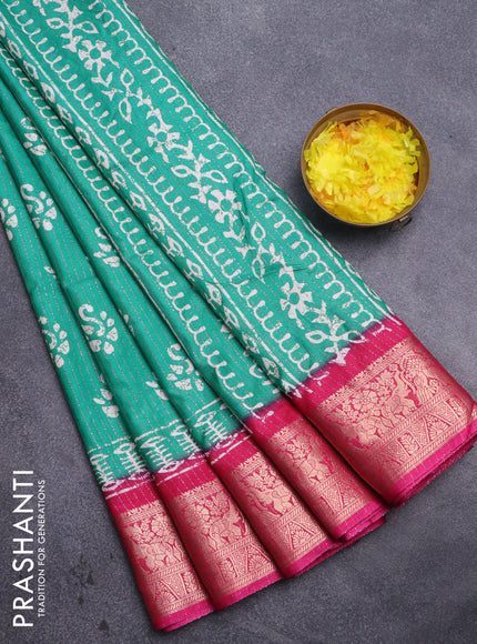 Semi dola saree teal green and pink with allover zari weaves & batik butta prints and zari woven border