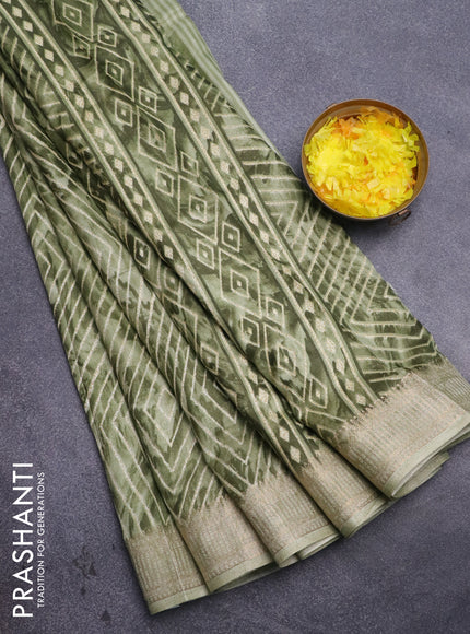 Semi dola saree pastel green with allover prints and zari woven border