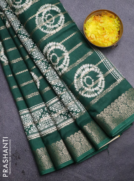 Semi dola saree green with allover zari strips & butta prints and zari woven border