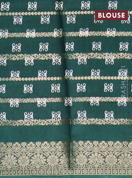 Semi dola saree green with allover zari strips & butta prints and zari woven border