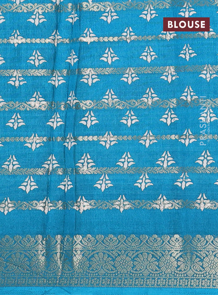 Semi dola saree teal blue with allover zari strips & butta prints and zari woven border