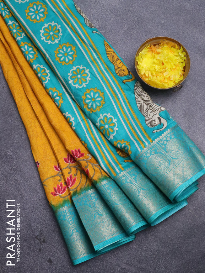 Semi dola saree mustard yelllow and teal green shade with allover prints and zari woven border