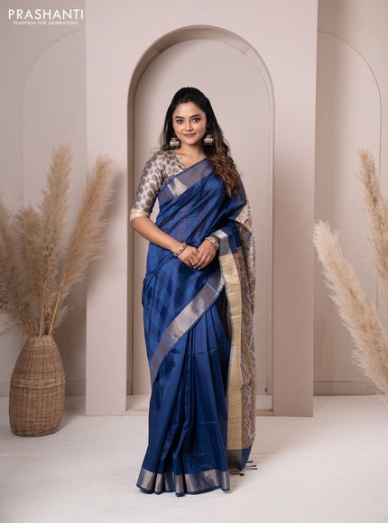 Semi tussar saree blue with plain body & madhubani printed pallu and zari woven border