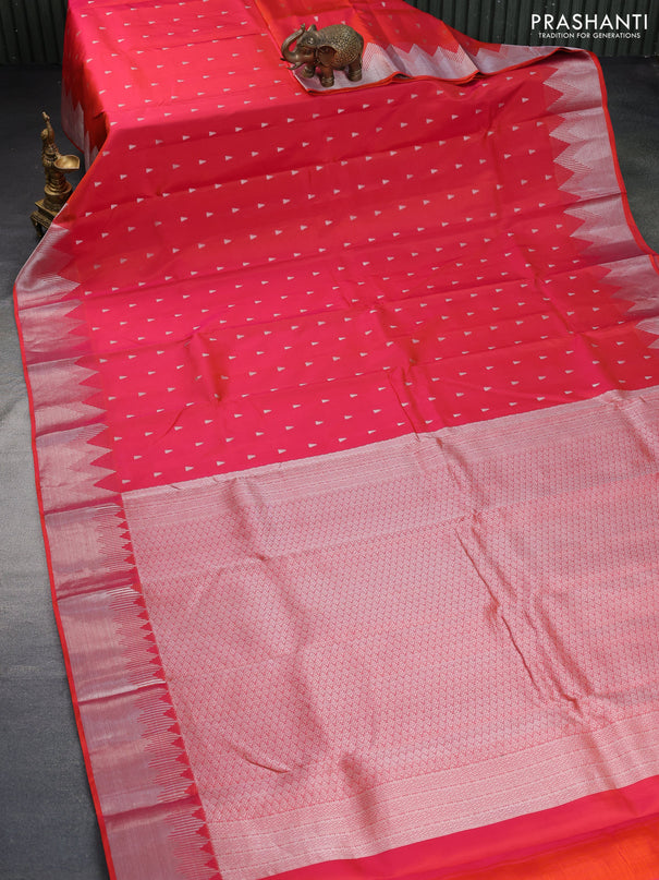 Pure kanchipuram silk saree dual shade of pinkish orange with silver zari woven buttas and silver zari woven border