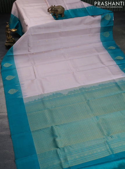 Pure kanchipuram silk saree beige and green with allover zari weaves and zari woven butta border