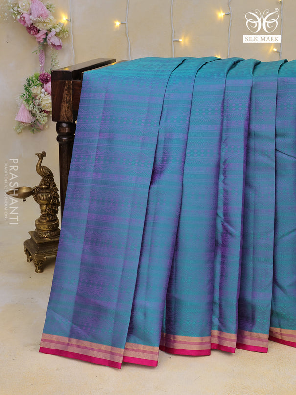 Pure kanchipuram silk saree teal blue and pink with allover self emboss and zari woven border