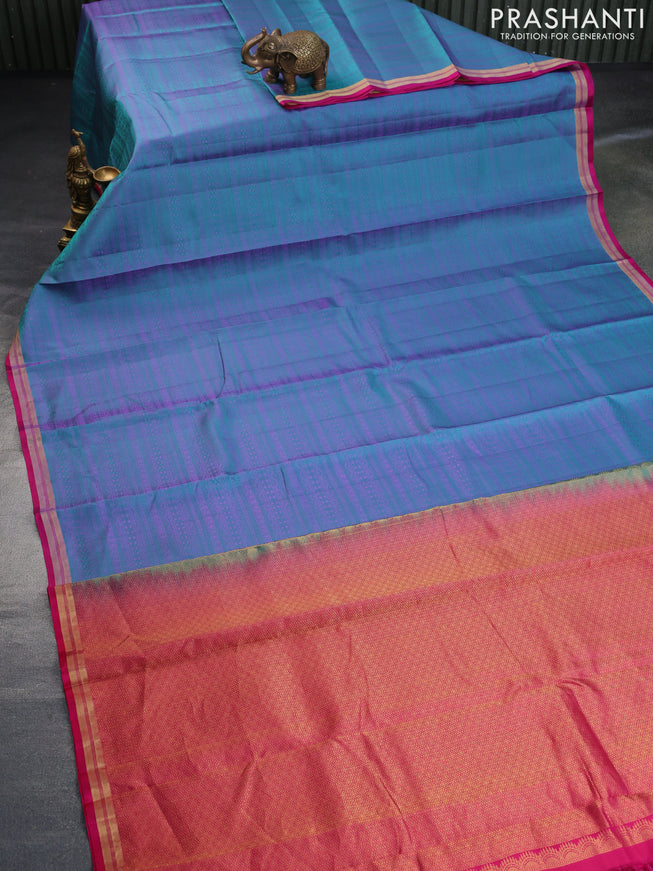 Pure kanchipuram silk saree teal blue and pink with allover self emboss and zari woven border