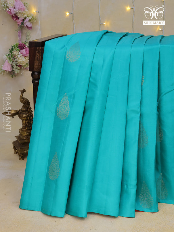 Pure kanchipuram silk saree teal blue and dual shade of pinkish orange with zari woven buttas in borderless style