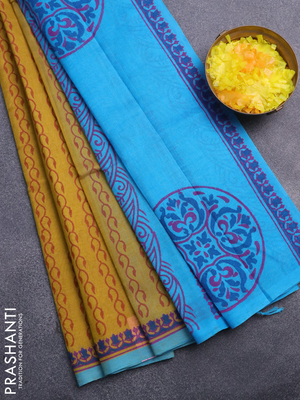 Silk cotton block printed saree mustard shade and blue with allover prints and printed border