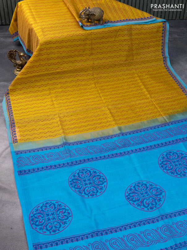 Silk cotton block printed saree mustard shade and blue with allover prints and printed border