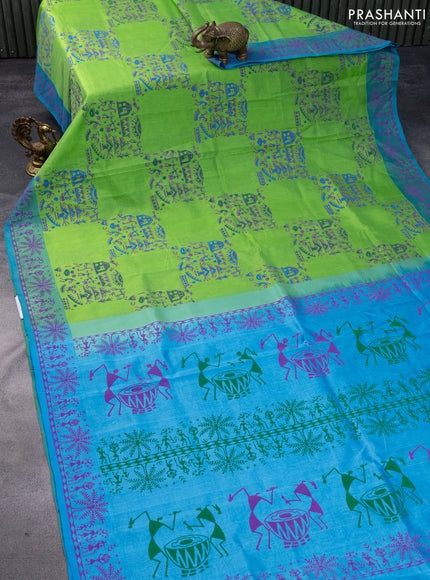 Silk cotton block printed saree light green and light blue with allover warli prints and printed border