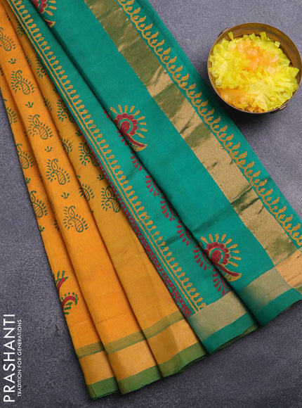 Silk cotton block printed saree mustard yellow and green with allover prints and zari woven border