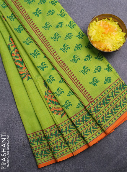 Silk cotton block printed saree light green and orange with butta prints and printed border