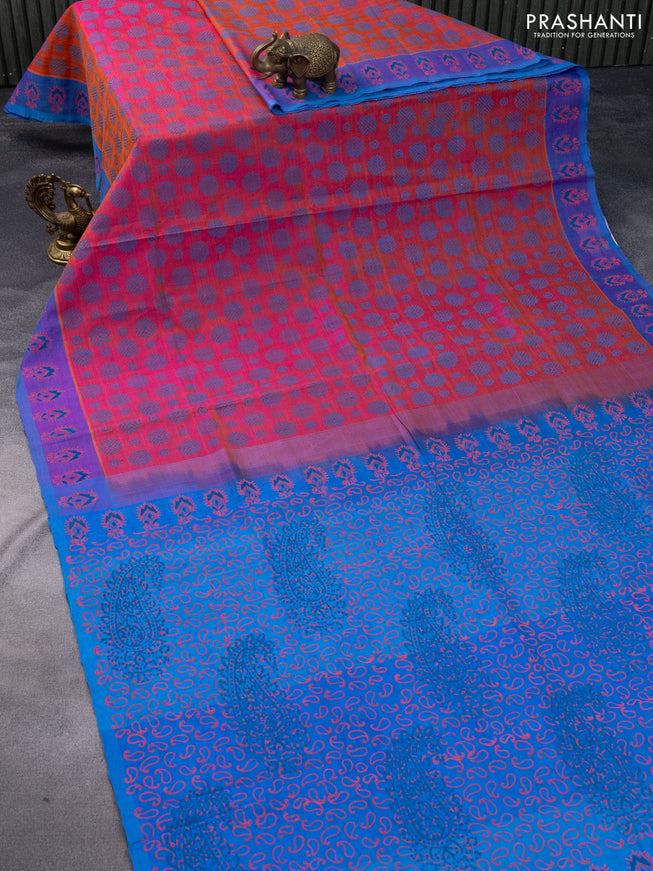 Silk cotton block printed saree dual shade of pinkish orange and blue with allover prints and printed border