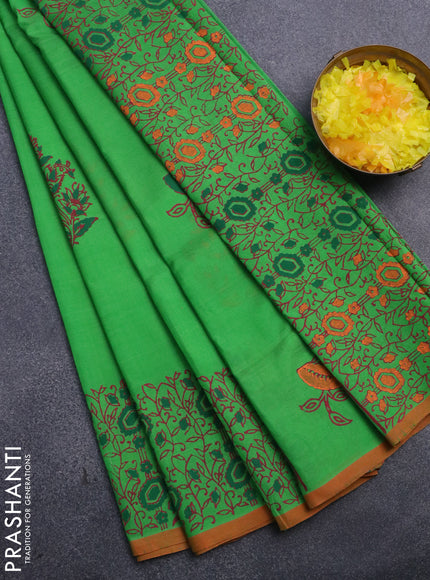 Silk cotton block printed saree light green and orange with butta prints and printed border