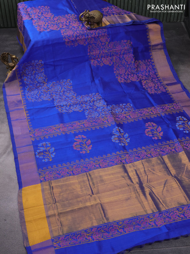 Silk cotton block printed saree blue with allover floral prints and zari woven border