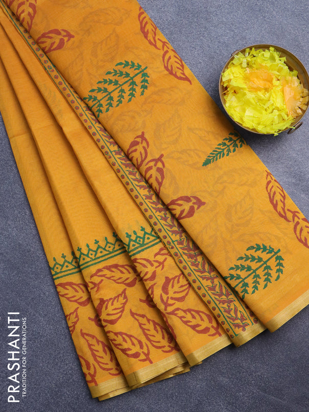 Silk cotton block printed saree mustard yellow with leaf butta prints and piping zari woven border