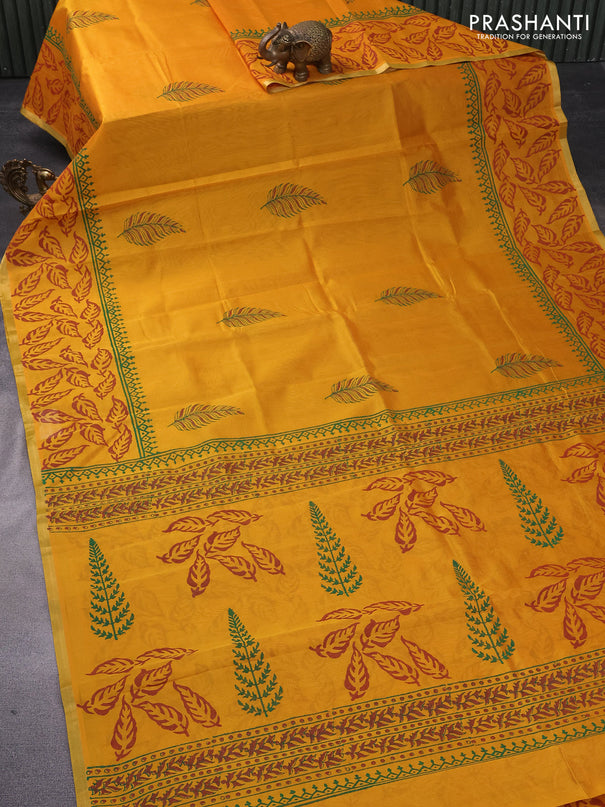 Silk cotton block printed saree mustard yellow with leaf butta prints and piping zari woven border