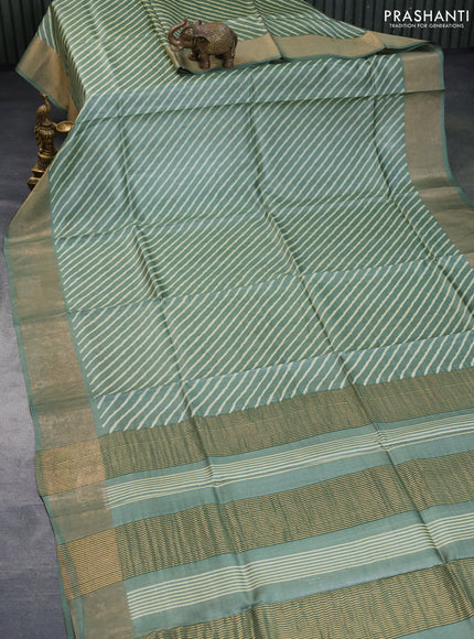 Pure tussar silk saree pastel green with allover leheriya prints and zari woven border