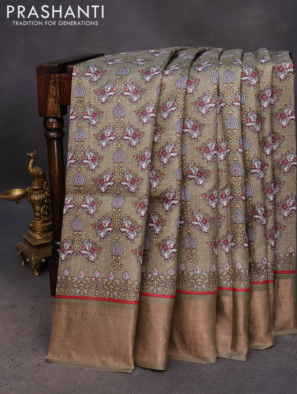 Pure tussar silk saree pastel green with allover elephant prints and zari woven border