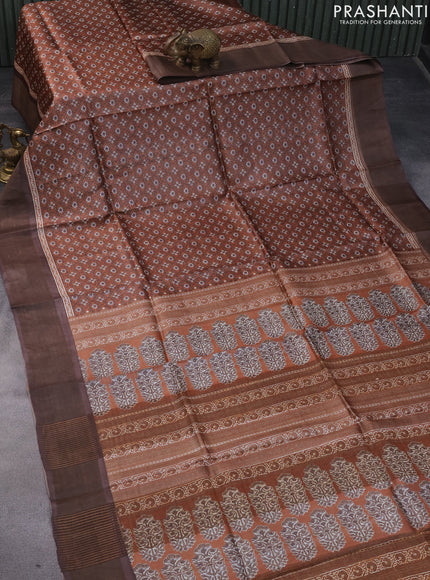 Pure tussar silk saree rust shade and brown with allover prints and zari woven border