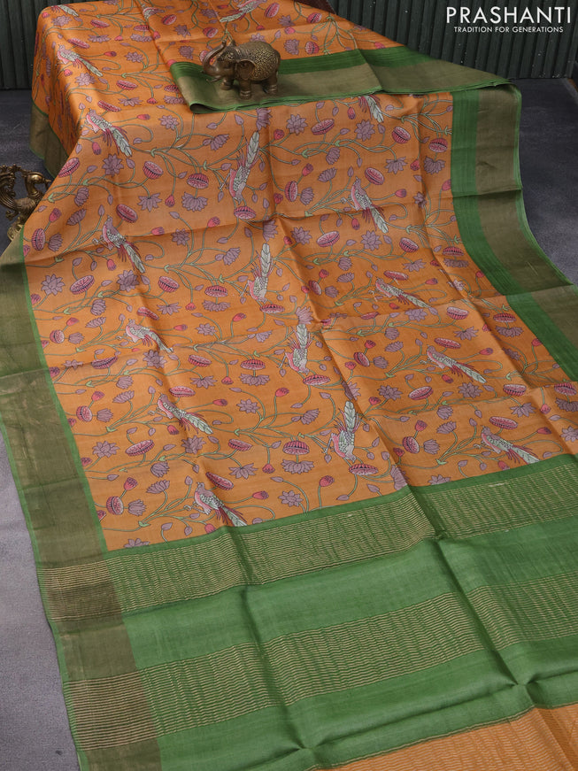 Pure tussar silk saree orange and green with allover kalamkari prints and zari woven border