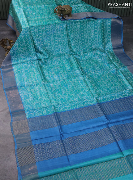 Pure tussar silk saree teal green and blue with allover prints and zari woven border