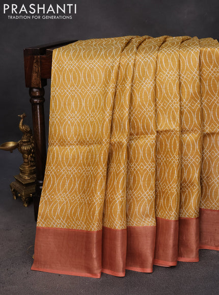 Pure tussar silk saree mustard yellow and peach orange with allover prints and zari woven border