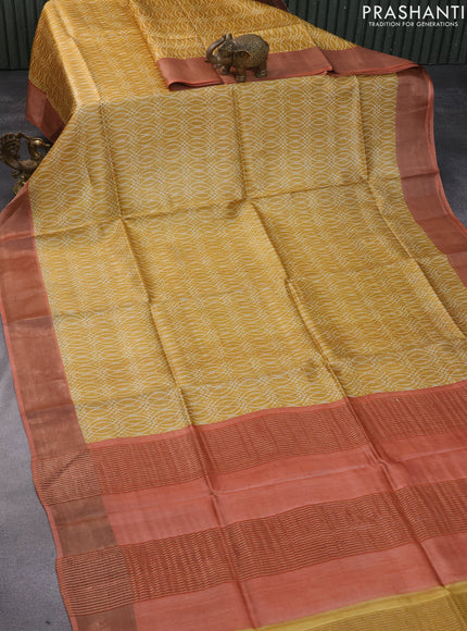 Pure tussar silk saree mustard yellow and peach orange with allover prints and zari woven border