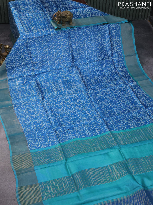 Pure tussar silk saree cs blue and teal blue with allover prints and zari woven border