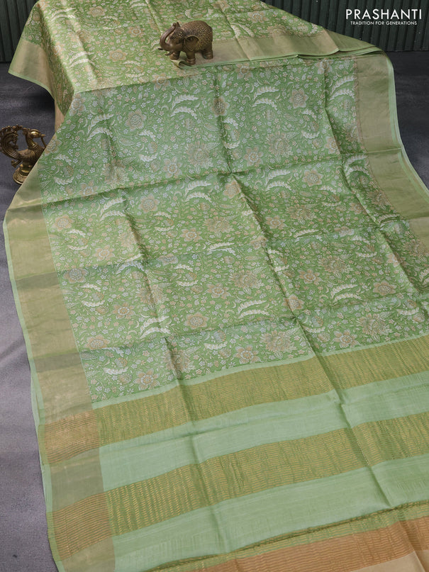 Pure tussar silk saree green shade with allover kalamkari prints and zari woven border