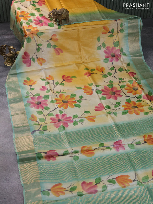 Pure tussar silk saree cream and pastel blue with hand painted floral prints and zari woven border