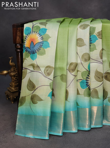 Pure tussar silk saree pastel green and teal blue with hand painted floral prints and zari woven border