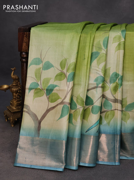 Pure tussar silk saree pastel green and blue with hand painted prints and zari woven border