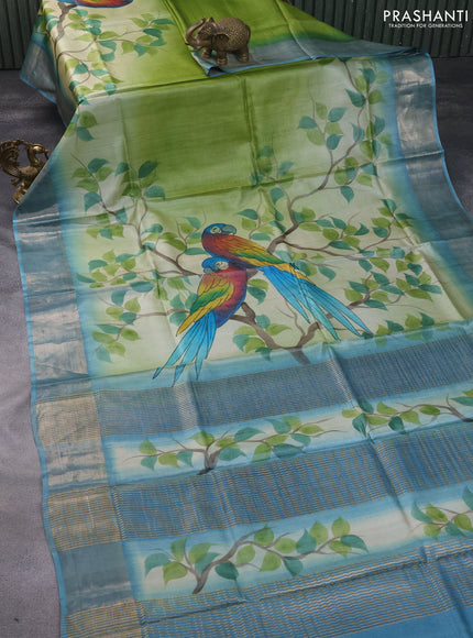 Pure tussar silk saree pastel green and blue with hand painted prints and zari woven border