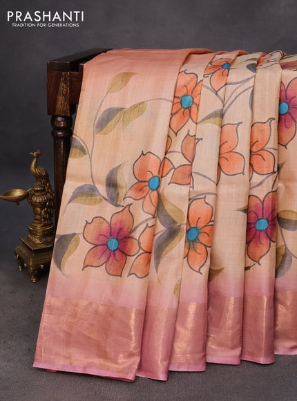 Pure tussar silk saree sandal and pastel pink with hand painted floral prints and zari woven border