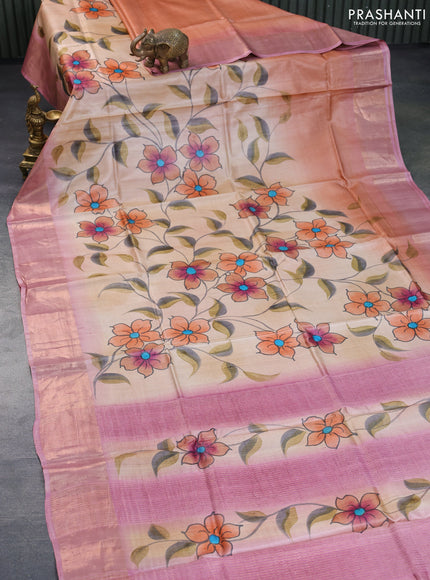 Pure tussar silk saree sandal and pastel pink with hand painted floral prints and zari woven border