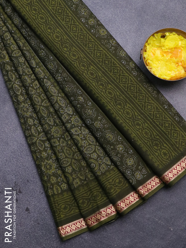 Muslin cotton saree sap green with allover ajrakh prints and thread woven border