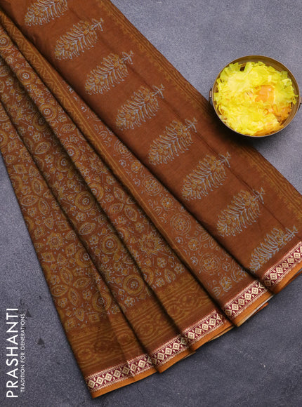 Muslin cotton saree dark mustard with allover ajrakh prints and thread woven border