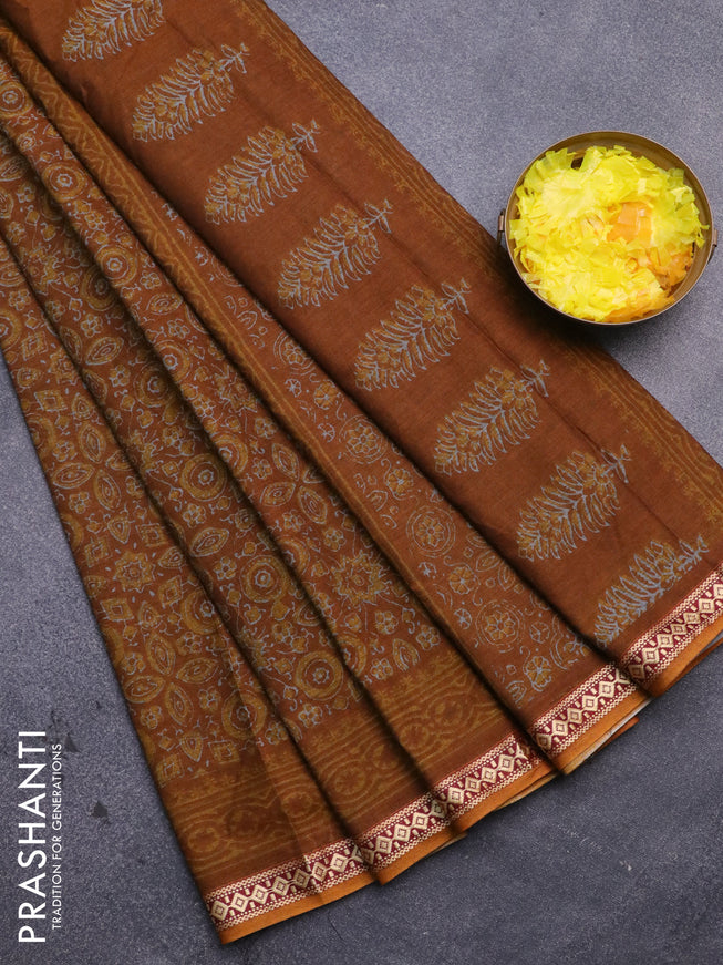 Muslin cotton saree dark mustard with allover ajrakh prints and thread woven border