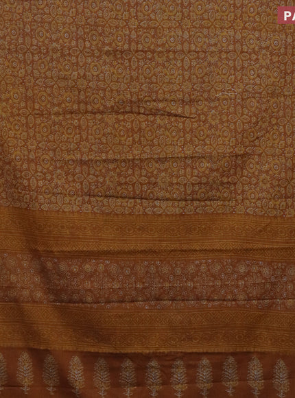 Muslin cotton saree dark mustard with allover ajrakh prints and thread woven border