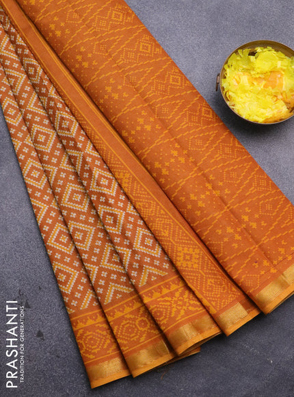 Muslin cotton saree mustard yellow with allover ikat prints and small zari woven border