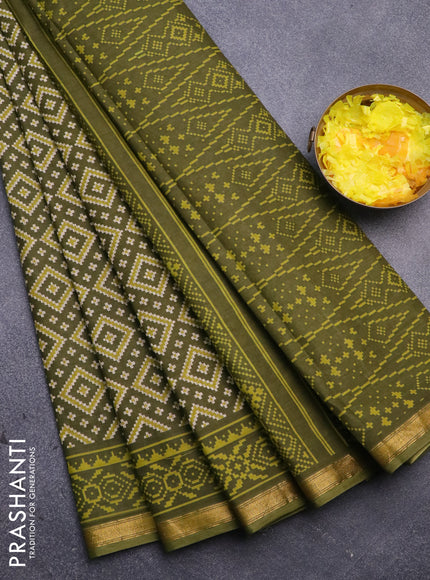 Muslin cotton saree sap green with allover ikat prints and small zari woven border