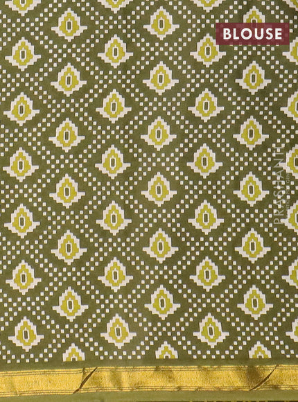 Muslin cotton saree sap green with allover ikat prints and small zari woven border