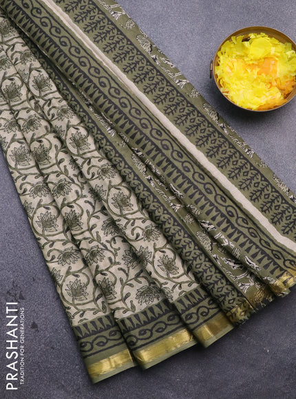 Muslin cotton saree cream and green with allover floral prints and small zari woven border